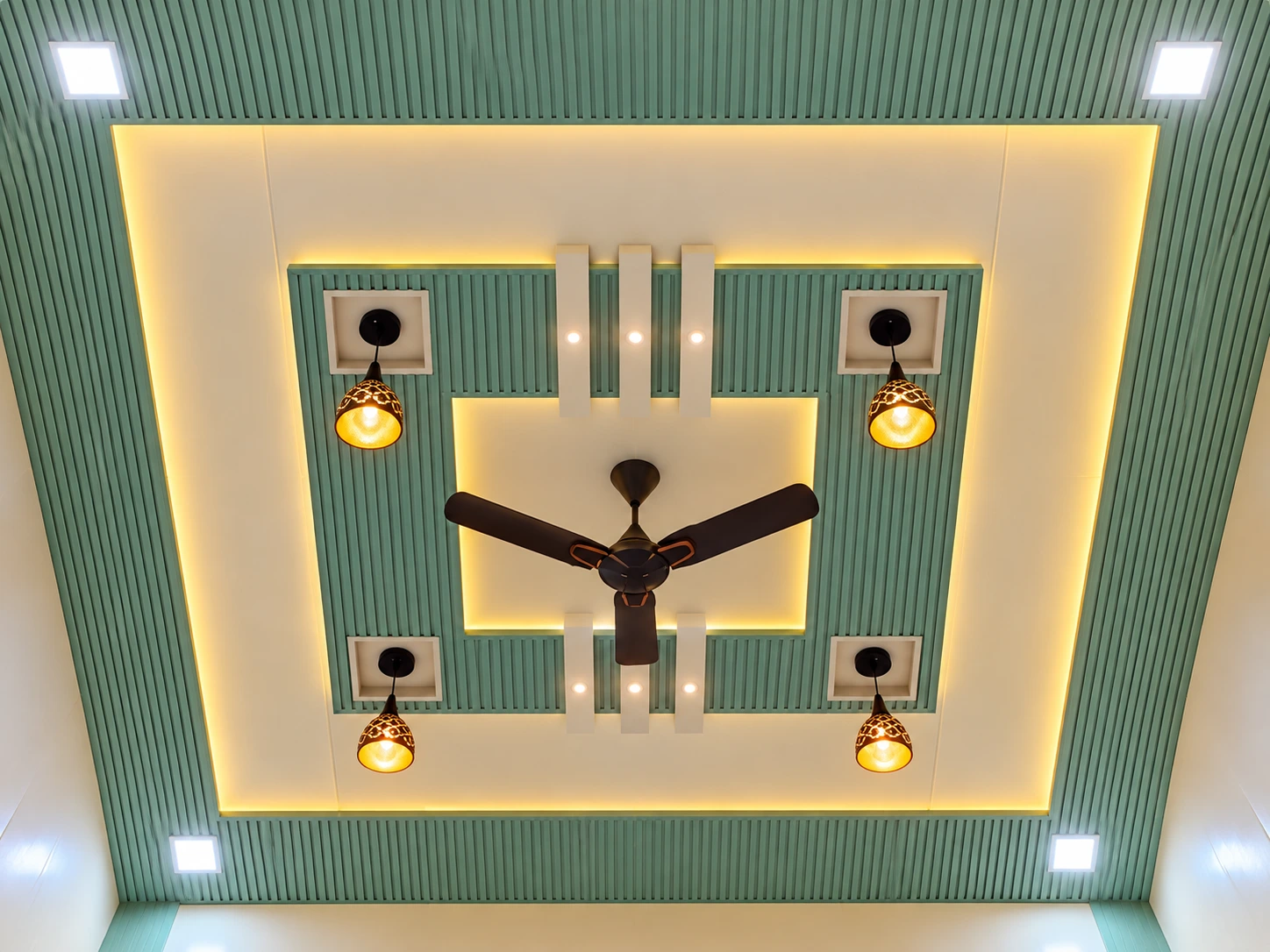Green fluted coffered PVC down ceiling with warm lighting