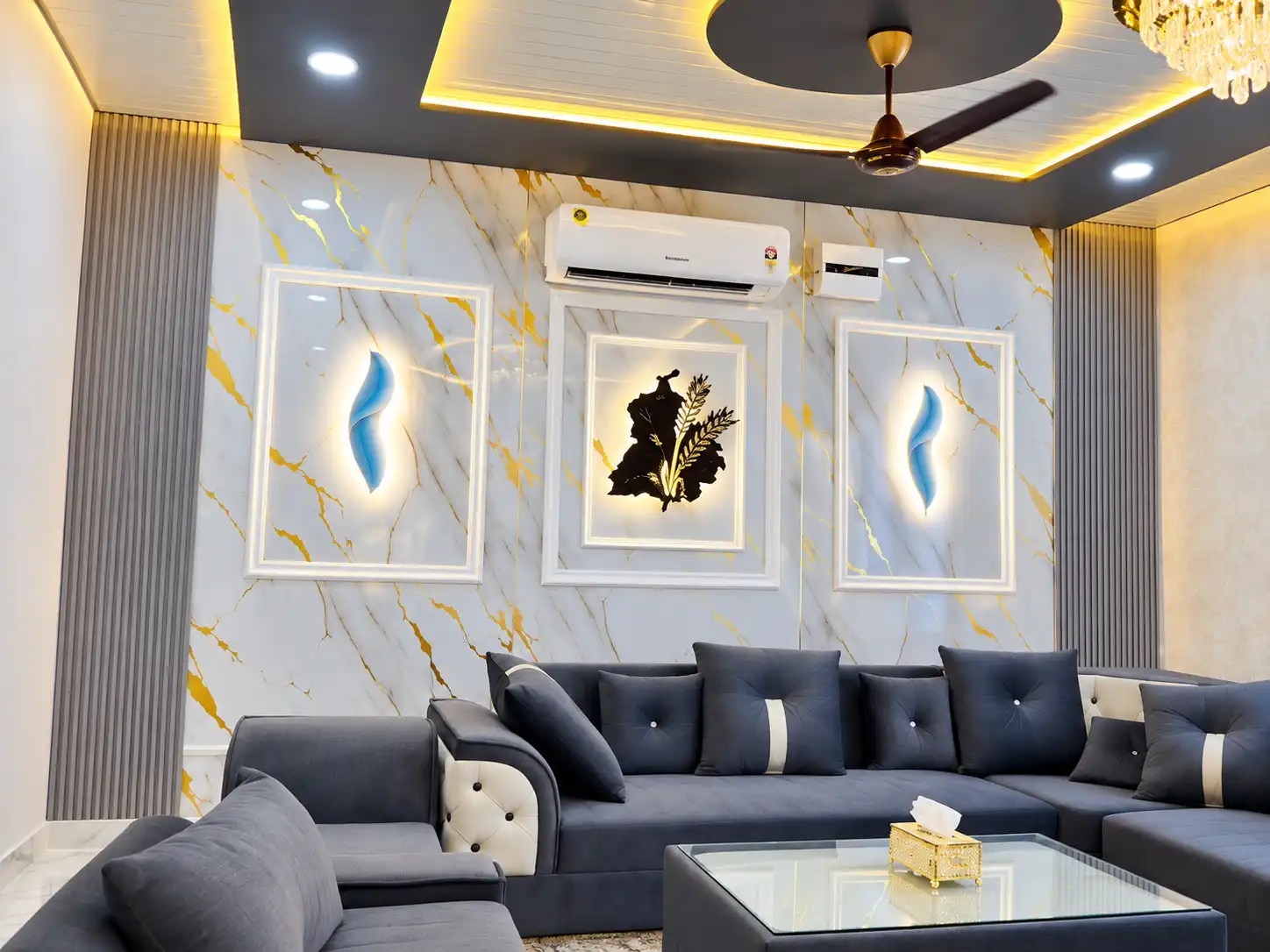 White marble-effect living-room feature wall with illuminated framed panels